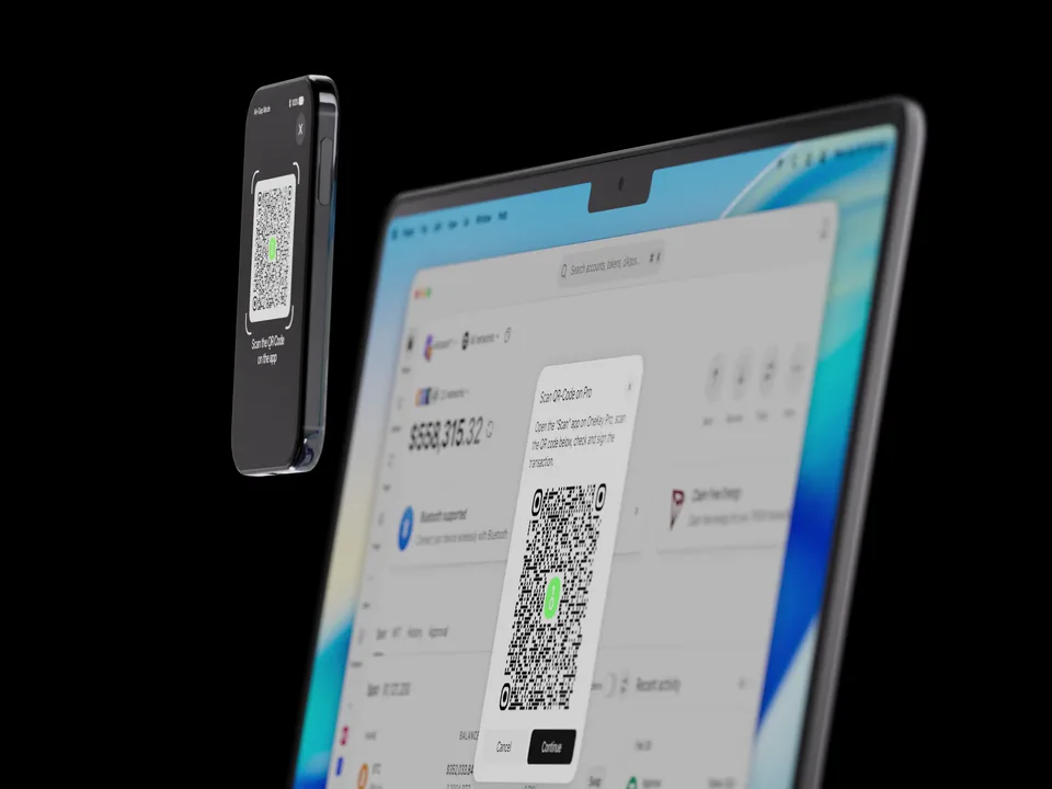 OneKey Pro 2 scanning a QR code shown in the OneKey App on a laptop