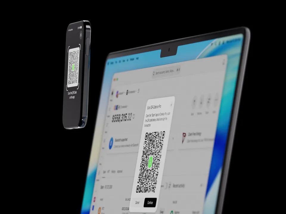 OneKey Pro 2 scanning a QR code shown in the OneKey App on a laptop